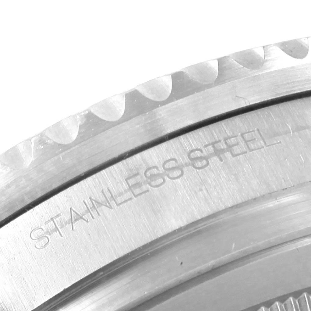 The image shows a close-up of the stainless steel bezel on a Rolex GMT-Master 116710 Men's Stainless Steel Black Dial 116710 Men's Stainless Steel Black Dial watch.