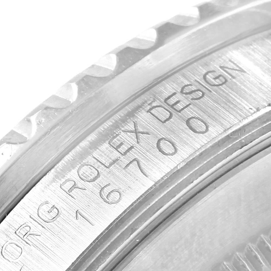This close-up image shows the side engraving and part of the bezel on a Rolex GMT-Master 16700 Men's Stainless Steel Black Dial 16700 Men's Stainless Steel Black Dial watch.