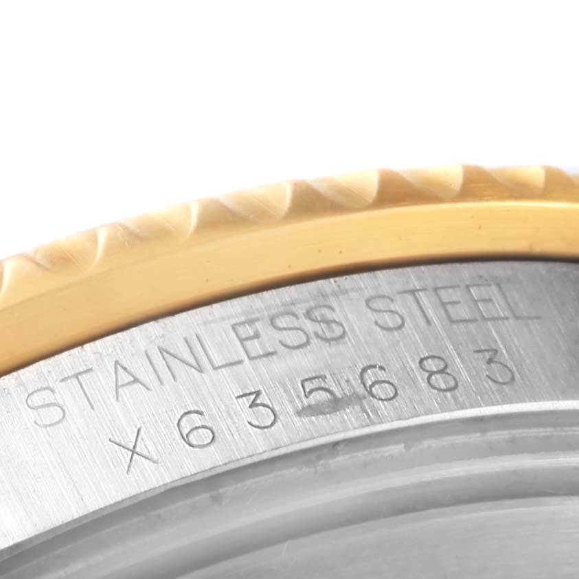 This close-up image shows the side of the Rolex GMT-Master 16713 Men's Stainless Steel Grey Dial 16713 Men's Stainless Steel Grey Dial watch case, highlighting its stainless steel material and engraved details.