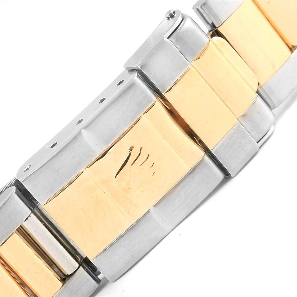 This image shows a close-up of the stainless steel and gold bracelet clasp of a Rolex GMT-Master 16713 Men's Stainless Steel Grey Dial 16713 Men's Stainless Steel Grey Dial watch.
