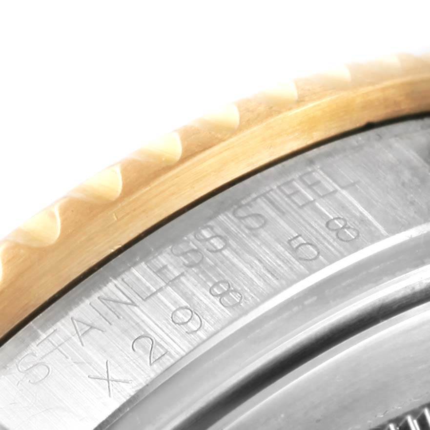 This image shows a close-up of the side detailing and part of the bezel of a Rolex GMT-Master 16713 Men's Stainless Steel Black Dial 16713 Men's Stainless Steel Black Dial watch.