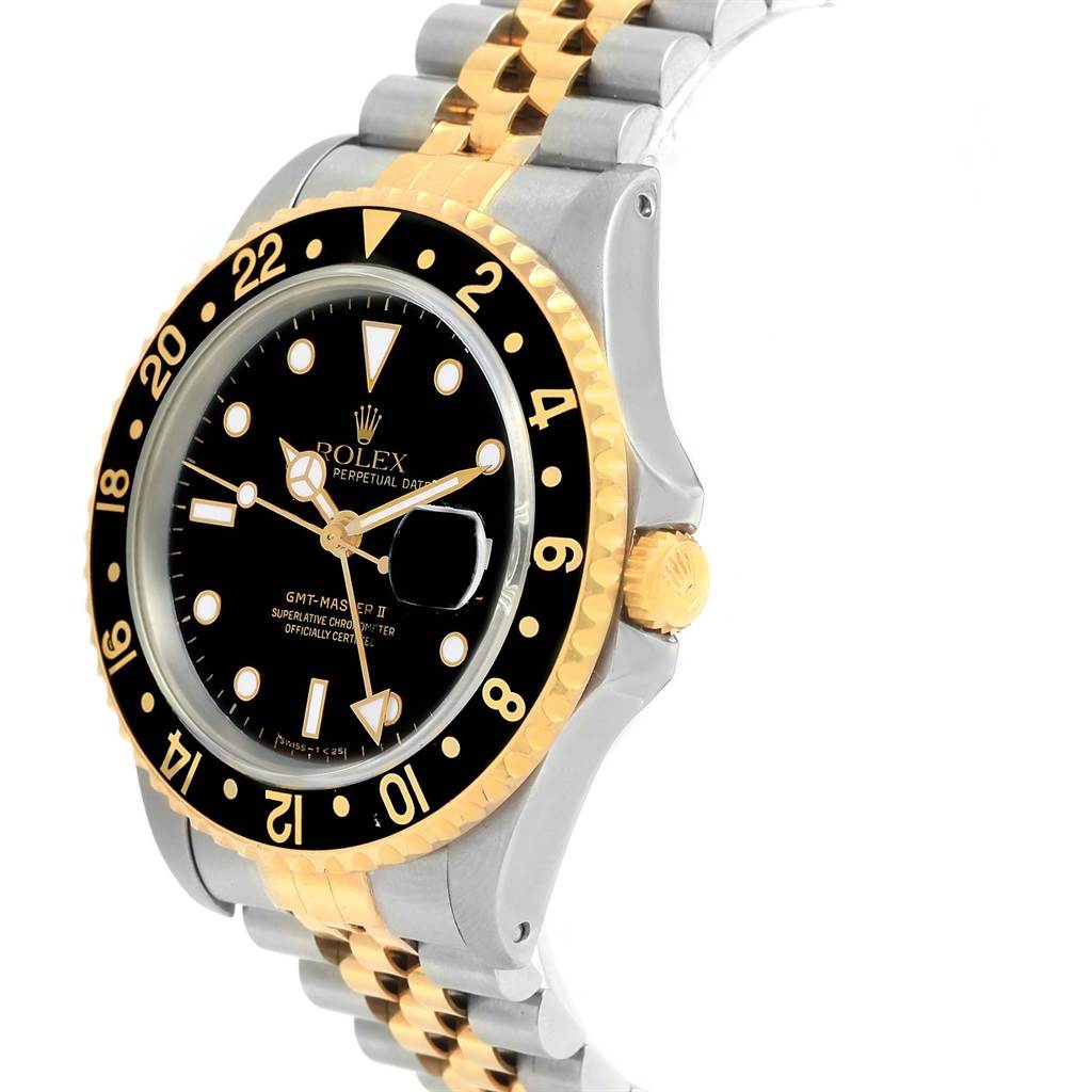 The Rolex GMT-Master 16713 Men's Stainless Steel Black Dial 16713 Men's Stainless Steel Black Dial watch is shown at a three-quarter angle, highlighting the bezel, dial, crown, and two-tone bracelet.