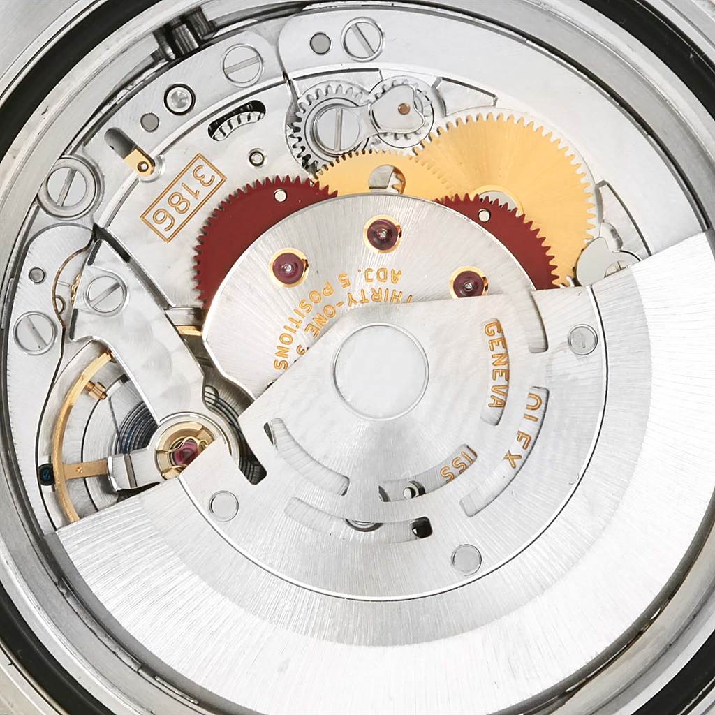 This image shows the internal mechanical movement of a Rolex GMT-Master 116713 Men's Stainless Steel Black Dial 116713 Men's Stainless Steel Black Dial watch, featuring gears and the rotor.
