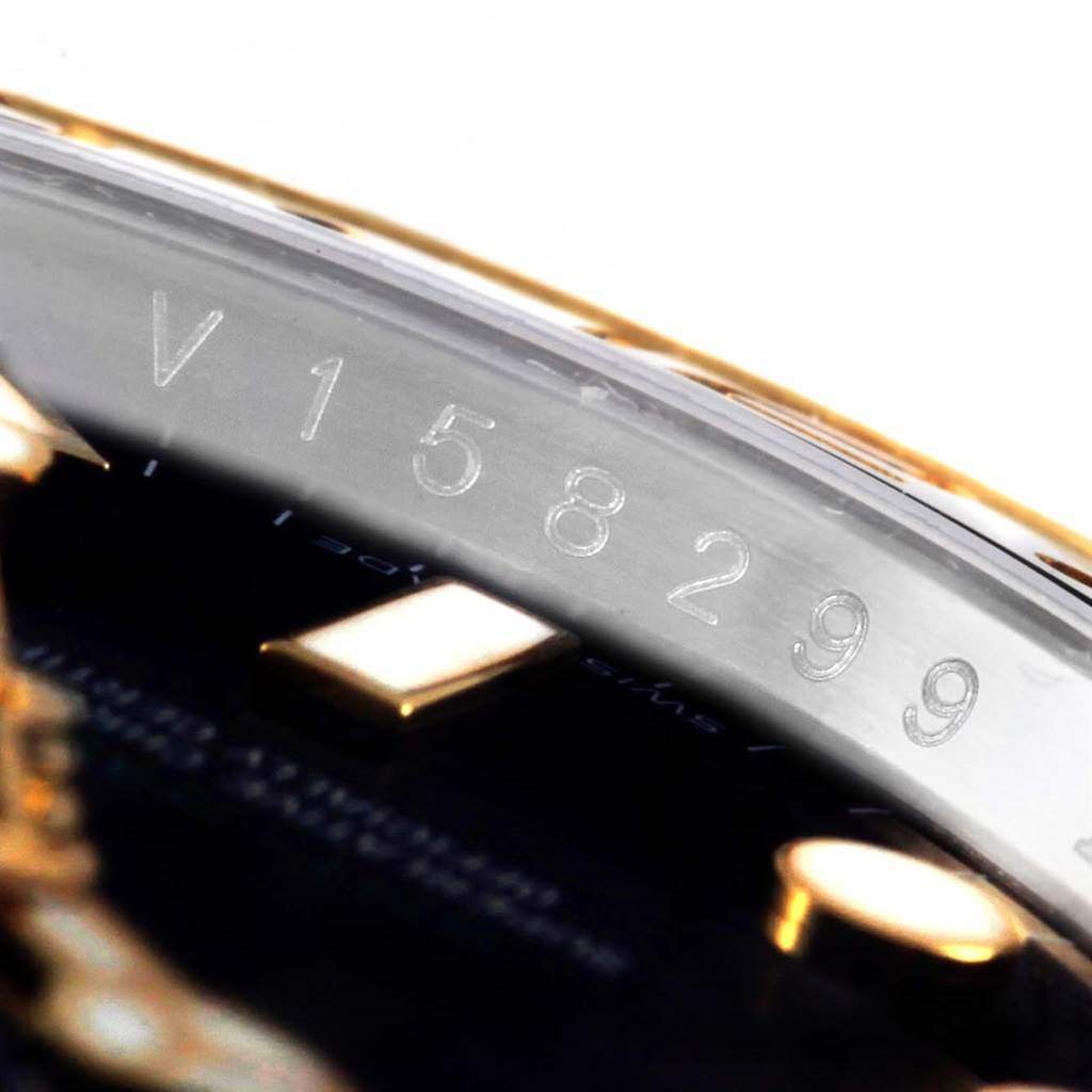 This angle shows a close-up of the serial number on the side of the Rolex GMT-Master 116713 Men's Stainless Steel Black Dial 116713 Men's Stainless Steel Black Dial watch's case.