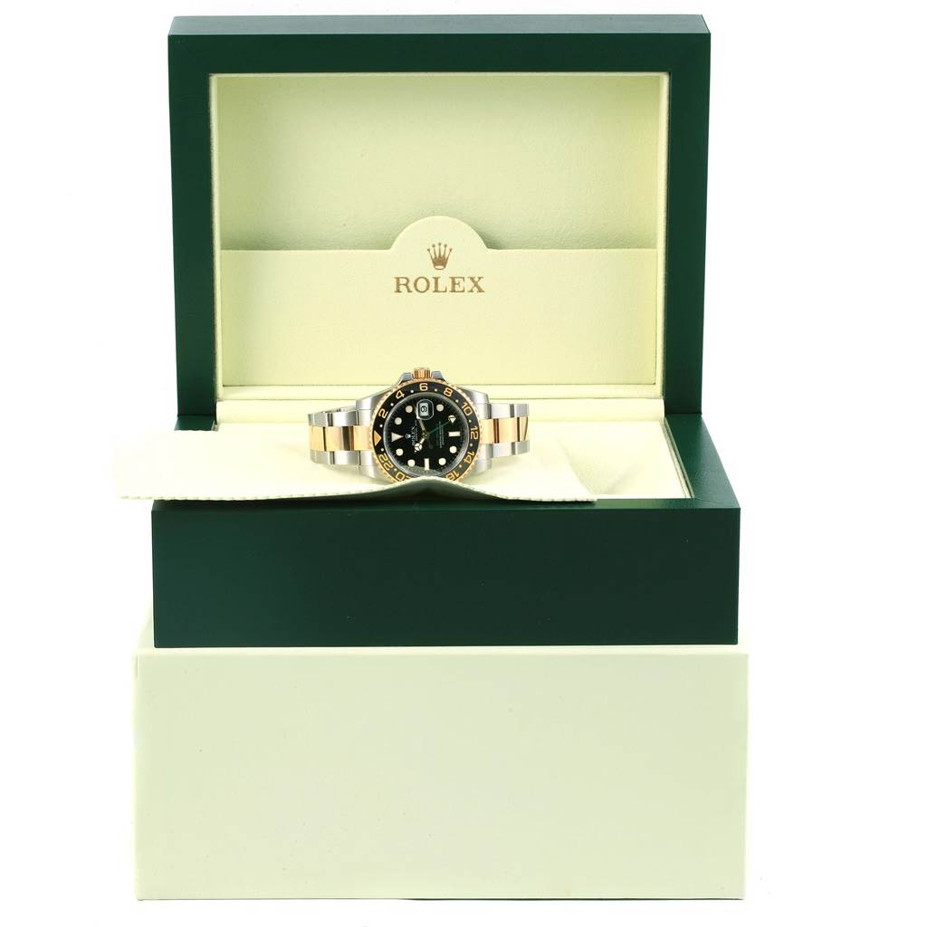The Rolex GMT-Master 116713 Men's Stainless Steel Black Dial 116713 Men's Stainless Steel Black Dial watch is displayed frontally inside its open box, showing the face and band.