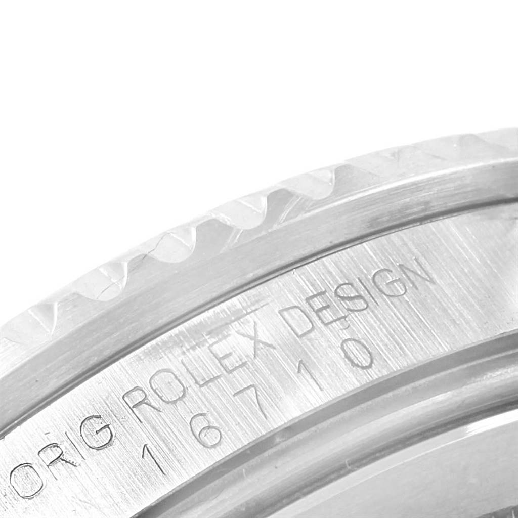 This close-up image shows the engraved Rolex design and model number on the side of the GMT-Master watch casing.