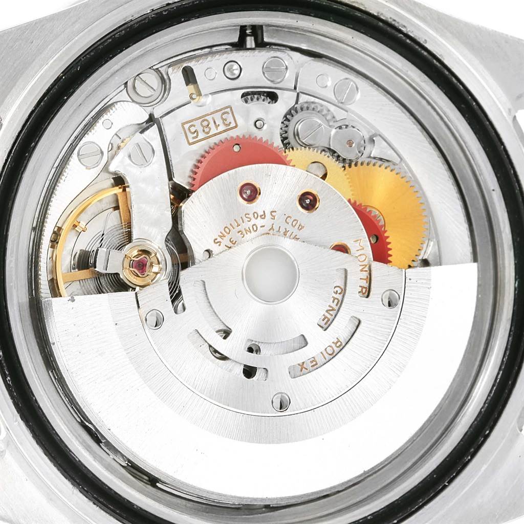This image shows the intricate internal mechanism of the Rolex GMT-Master 16710 Men's Stainless Steel Black Dial 16710 Men's Stainless Steel Black Dial, including gears and plates, viewed from the back.