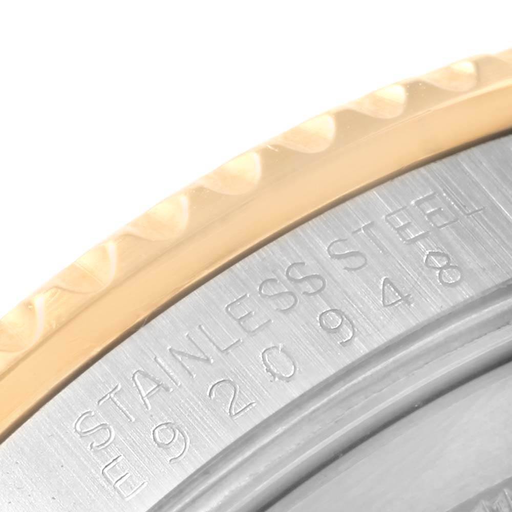 The image shows a close-up of the stainless steel case back and gold bezel of a Rolex GMT-Master 16713 Men's Stainless Steel Black Dial 16713 Men's Stainless Steel Black Dial watch.