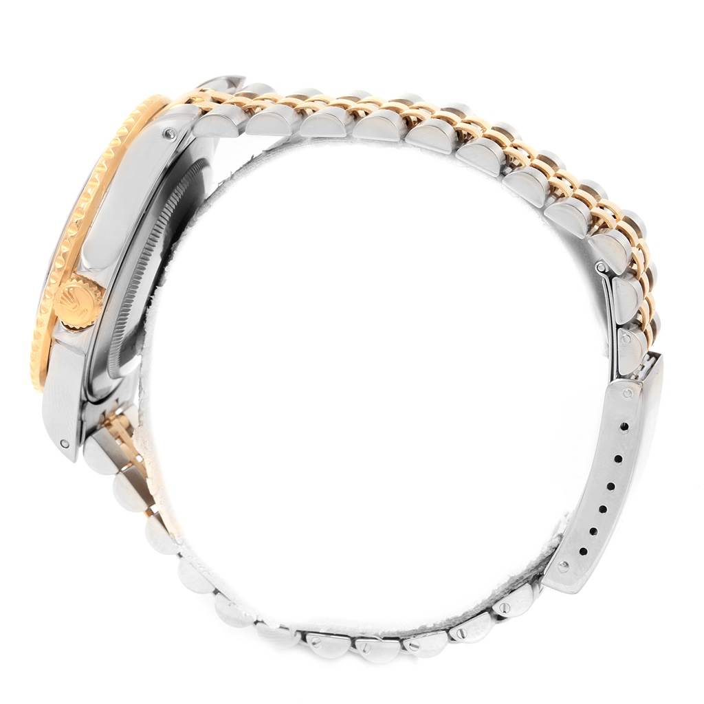 The image shows a side view of the Rolex GMT-Master 16713 Men's Stainless Steel Black Dial 16713 Men's Stainless Steel Black Dial watch, highlighting its bezel, crown, and two-tone bracelet.