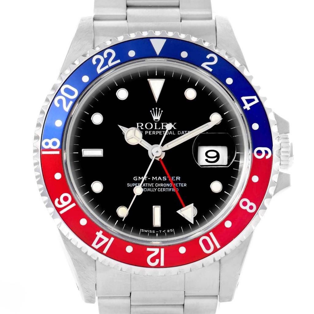 The image shows a front view of a Rolex GMT-Master 16700 Men
s Stainless Steel Black Dial 16700 Men
s Stainless Steel Black Dial watch, highlighting its black dial, red and blue bezel, and metal bracelet.