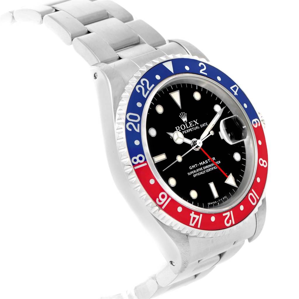 This image shows a side angle of the Rolex GMT-Master 16700 Men
s Stainless Steel Black Dial 16700 Men
s Stainless Steel Black Dial watch, highlighting its red and blue bezel, black dial, and stainless steel bracelet.