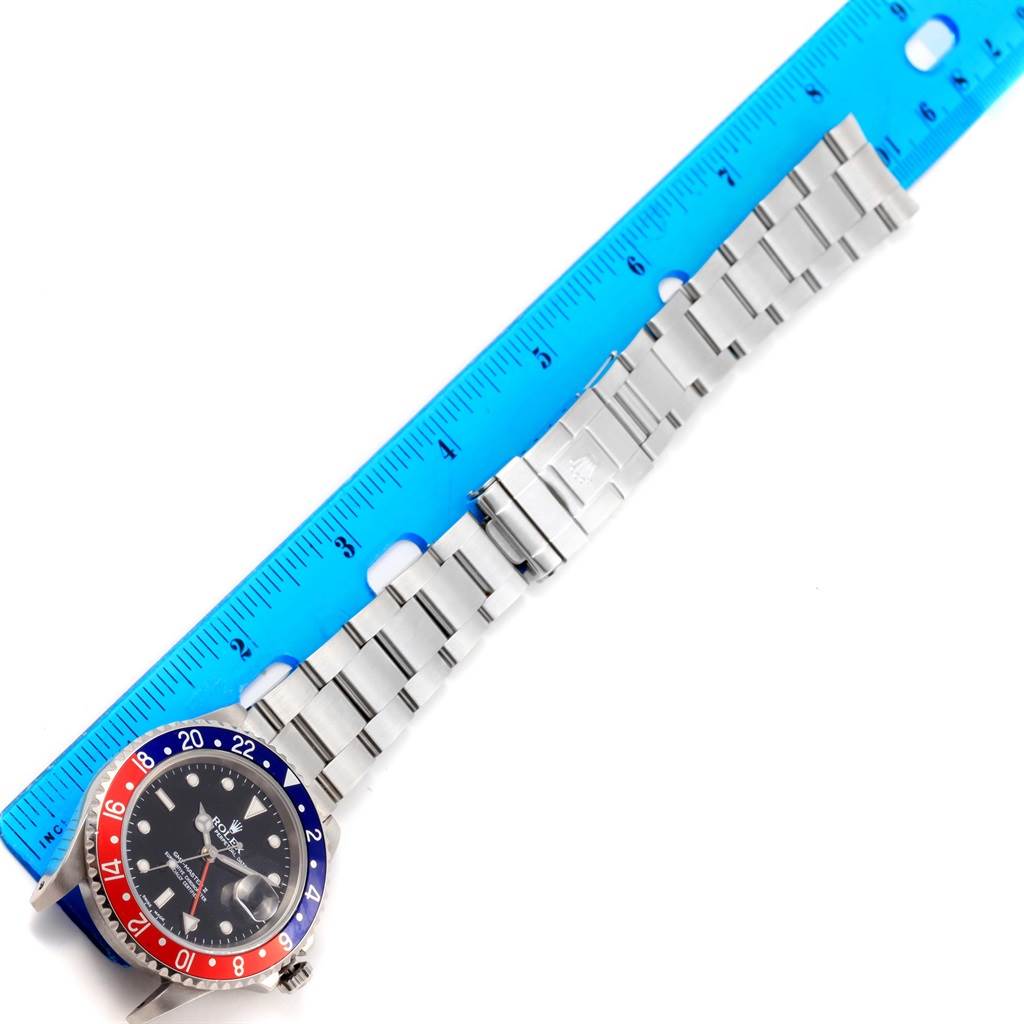 The Rolex GMT-Master 16710 Men's Stainless Steel Black Dial 16710 Men's Stainless Steel Black Dial watch is shown from an overhead angle, featuring a full view of the face, bezel, and the stainless steel bracelet.