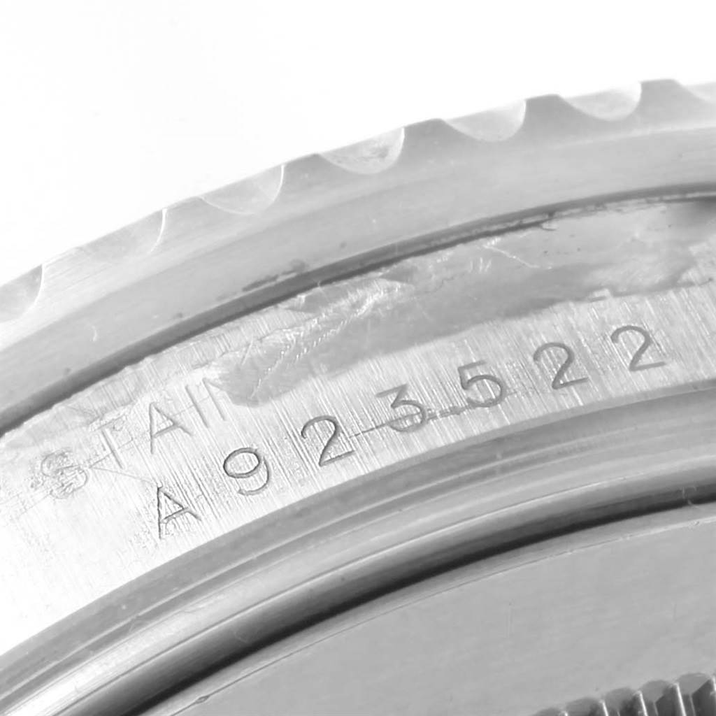 This is a close-up view of the casing, showing the serial number on the bezel of the Rolex GMT-Master 16710 Men's Stainless Steel Black Dial 16710 Men's Stainless Steel Black Dial watch.