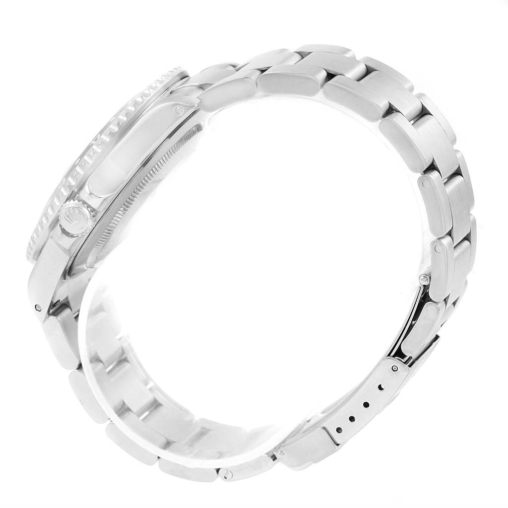 This side view image showcases the case, bezel, crown, and partially folded bracelet of the Rolex GMT-Master 16710 Men's Stainless Steel Black Dial 16710 Men's Stainless Steel Black Dial watch.