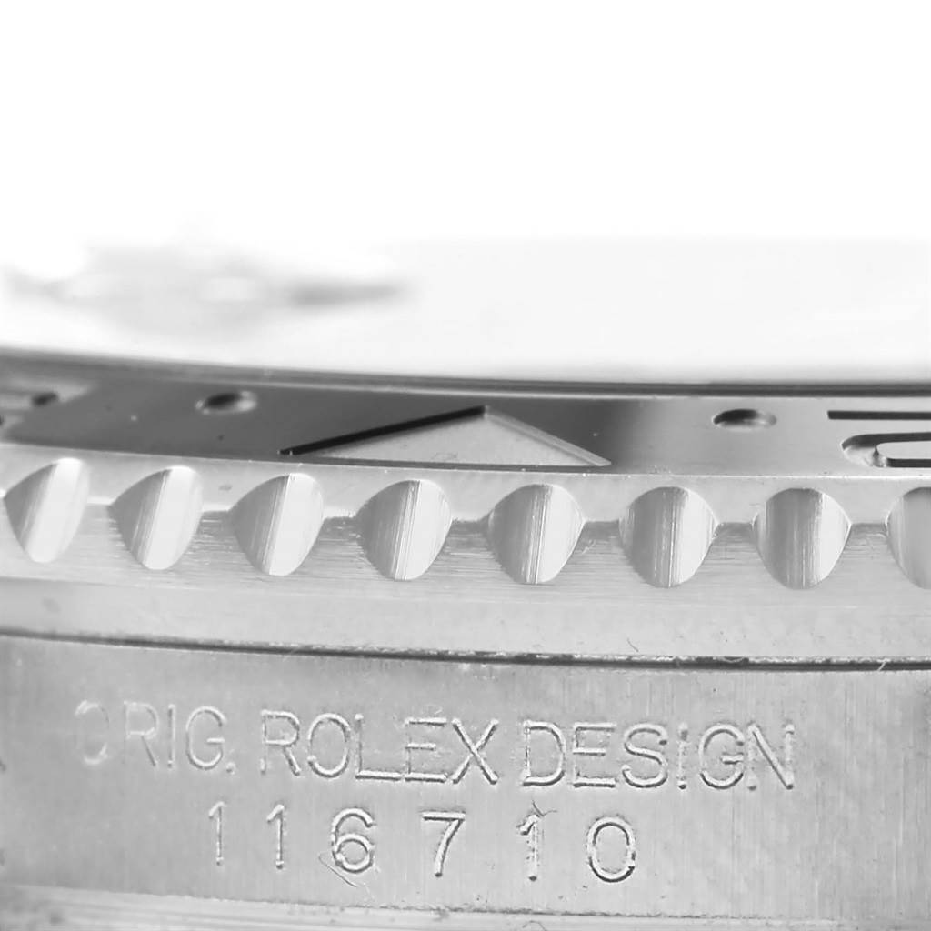 The image shows a close-up of the bezel and case side of a Rolex GMT-Master 116710 Men's Stainless Steel Black Dial 116710 Men's Stainless Steel Black Dial, including the bezel's teeth and model engraving.