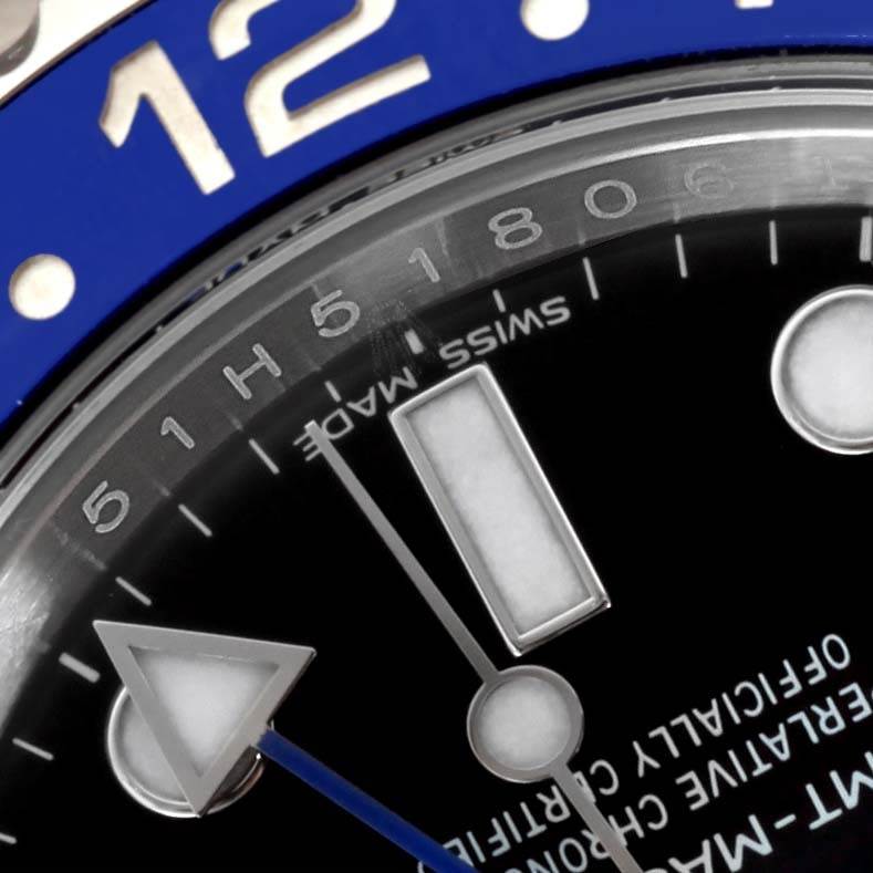 This close-up photo of a Rolex GMT-Master 116710 Men's Stainless Steel Black Dial 116710 Men's Stainless Steel Black Dial watch highlights the bezel, dial, and part of the hour hand.