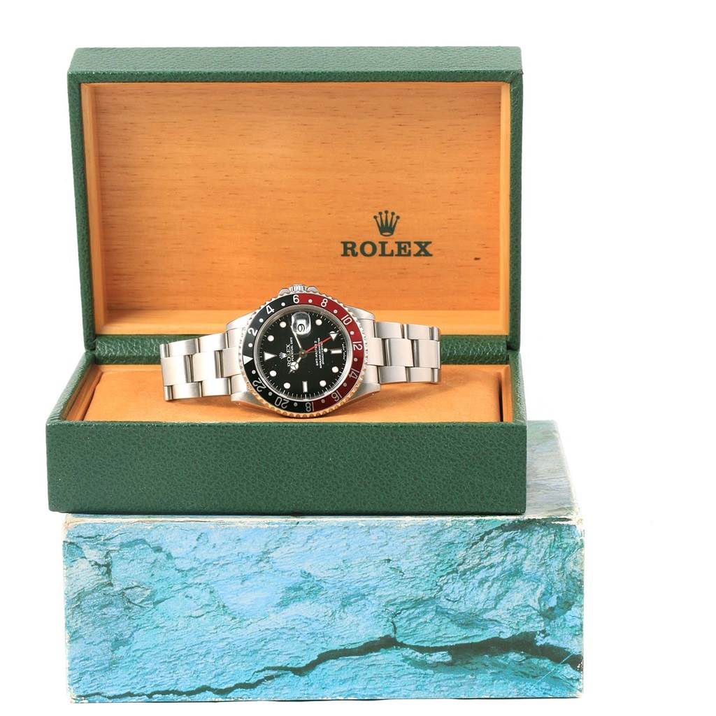 This image shows a Rolex GMT-Master 16710 Men's Stainless Steel Black Dial 16710 Men's Stainless Steel Black Dial watch front-on in an open Rolex box.