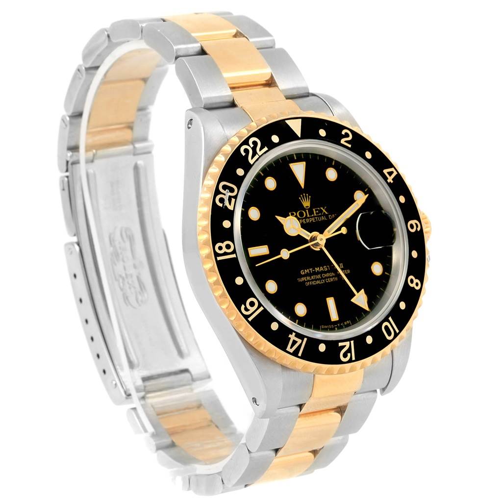 The image shows a Rolex GMT-Master 16713 Men
s Stainless Steel Black Dial 16713 Men
s Stainless Steel Black Dial watch at an angled side view, highlighting the two-tone bracelet, bezel, and dial.