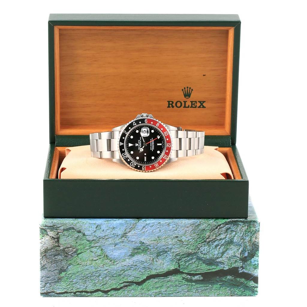 The Rolex GMT-Master 16710 Men's Stainless Steel Black Dial 16710 Men's Stainless Steel Black Dial watch is shown from the front within an open display box.