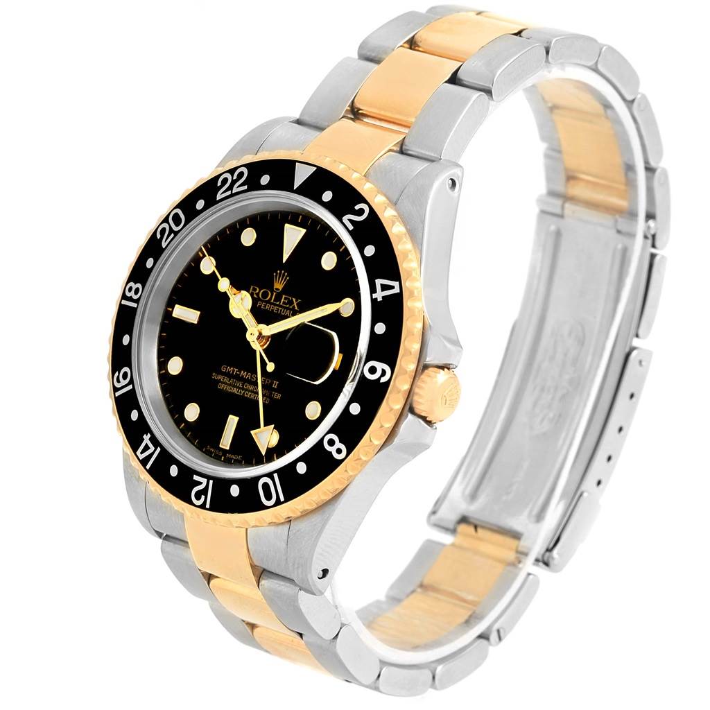 The Rolex GMT-Master 16713 Men's Stainless Steel Black Dial 16713 Men's Stainless Steel Black Dial watch is shown at an angled view, highlighting the bezel, dial, and two-tone bracelet.