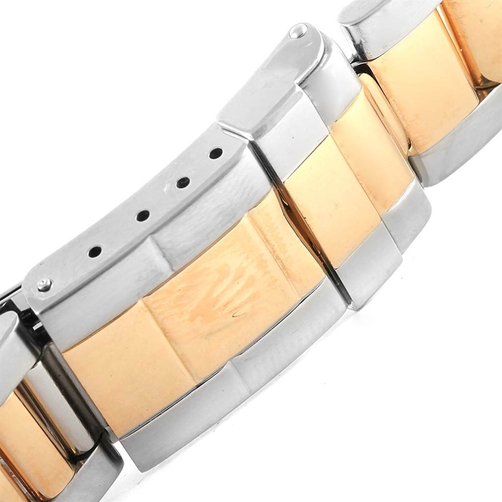 This image shows a close-up of the two-tone bracelet clasp of a Rolex GMT-Master 16713 Men's Stainless Steel Black Dial 16713 Men's Stainless Steel Black Dial watch.