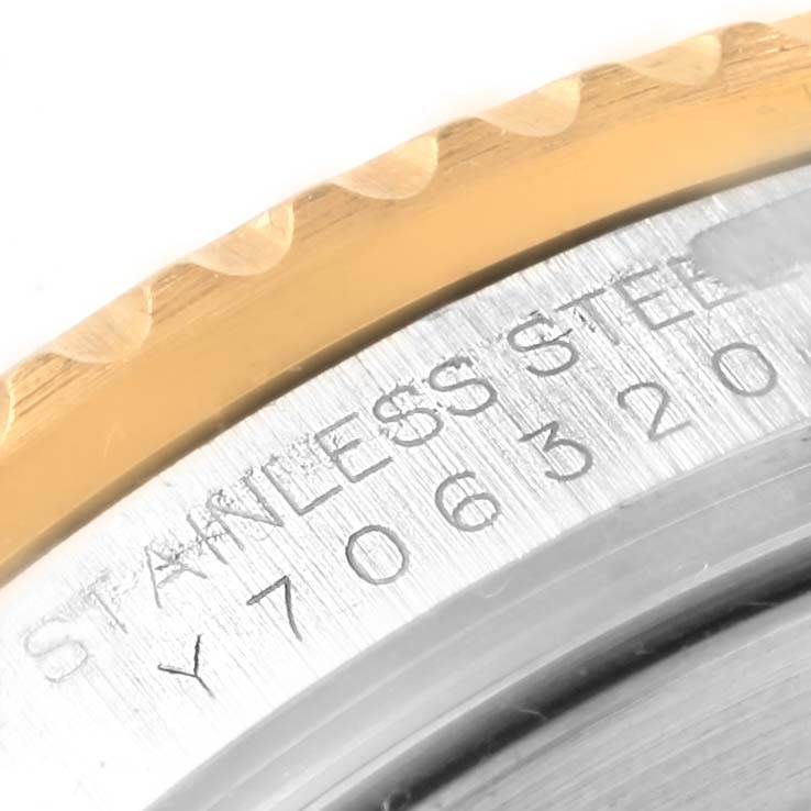 This close-up shows the engraved case back and a part of the bezel of a Rolex GMT-Master 16713 Men's Stainless Steel Black Dial 16713 Men's Stainless Steel Black Dial watch.