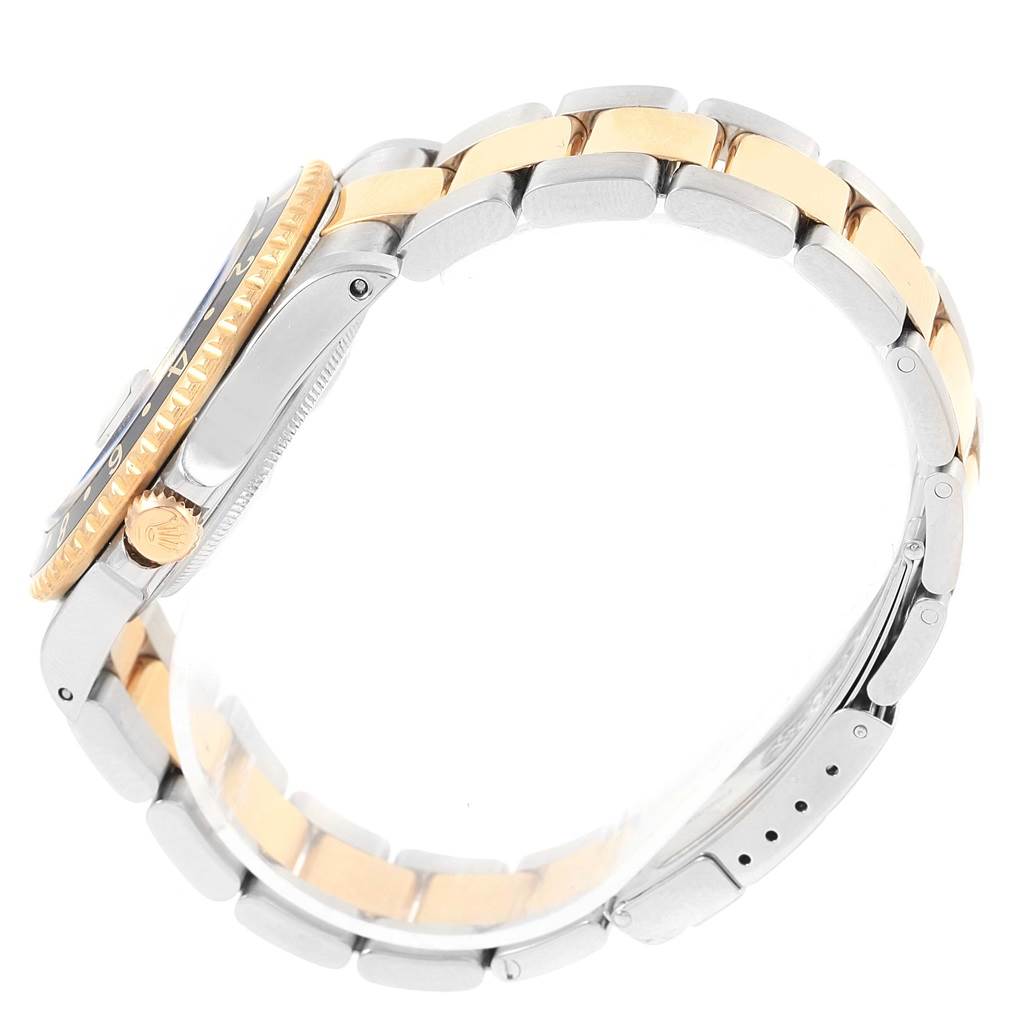 The image shows a side view of the Rolex GMT-Master 16713 Men's Stainless Steel Black Dial 16713 Men's Stainless Steel Black Dial watch, highlighting the case, bezel, crown, and two-tone bracelet.