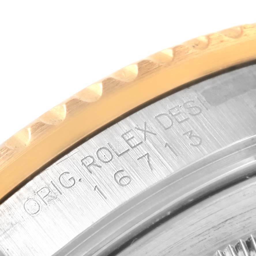 This image shows a close-up of the case back and edge of the bezel of a Rolex GMT-Master 16713 Men's Stainless Steel Black Dial 16713 Men's Stainless Steel Black Dial watch.