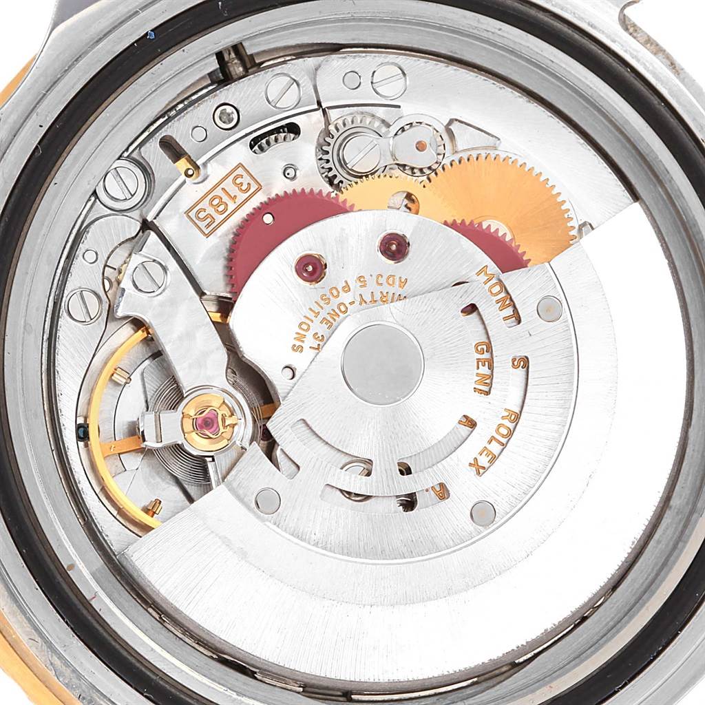 This image shows a close-up view of the movement mechanism inside a Rolex GMT-Master 16713 Men's Stainless Steel Black Dial 16713 Men's Stainless Steel Black Dial watch.