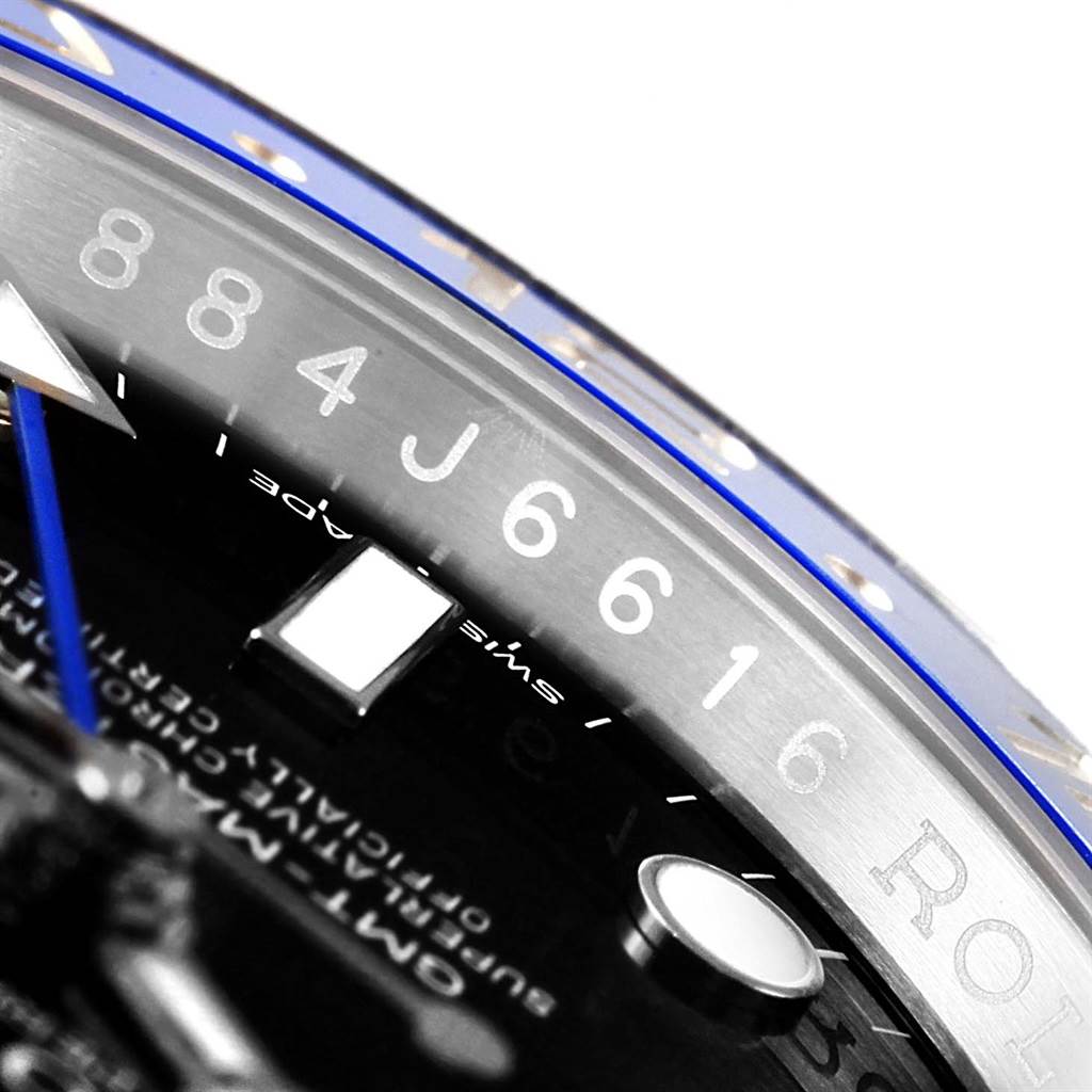 The image shows a close-up of the bezel and part of the dial of a Rolex GMT-Master 116710 Men's Stainless Steel Black Dial 116710 Men's Stainless Steel Black Dial watch, highlighting the numbers and markings.