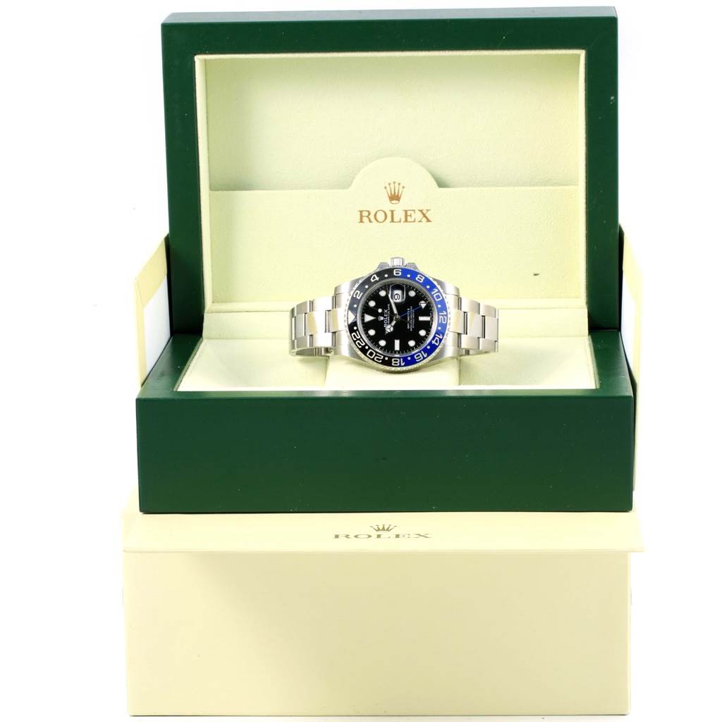 The image shows a Rolex GMT-Master 116710 Men's Stainless Steel Black Dial 116710 Men's Stainless Steel Black Dial watch in its open green and beige box, viewed from the front.