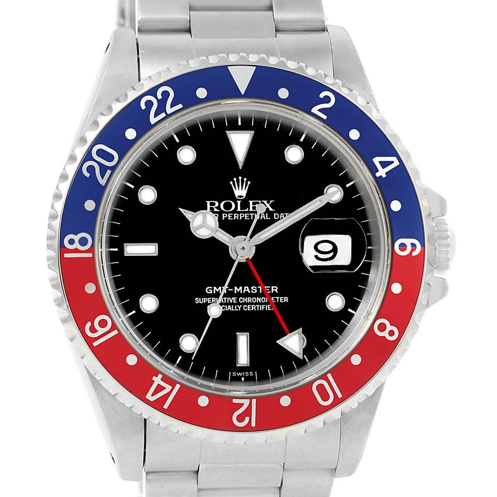 This image shows the face and bezel of a Rolex GMT-Master 16700 Men's Stainless Steel Black Dial 16700 Men's Stainless Steel Black Dial watch, including its distinctive red and blue "Pepsi" bezel.