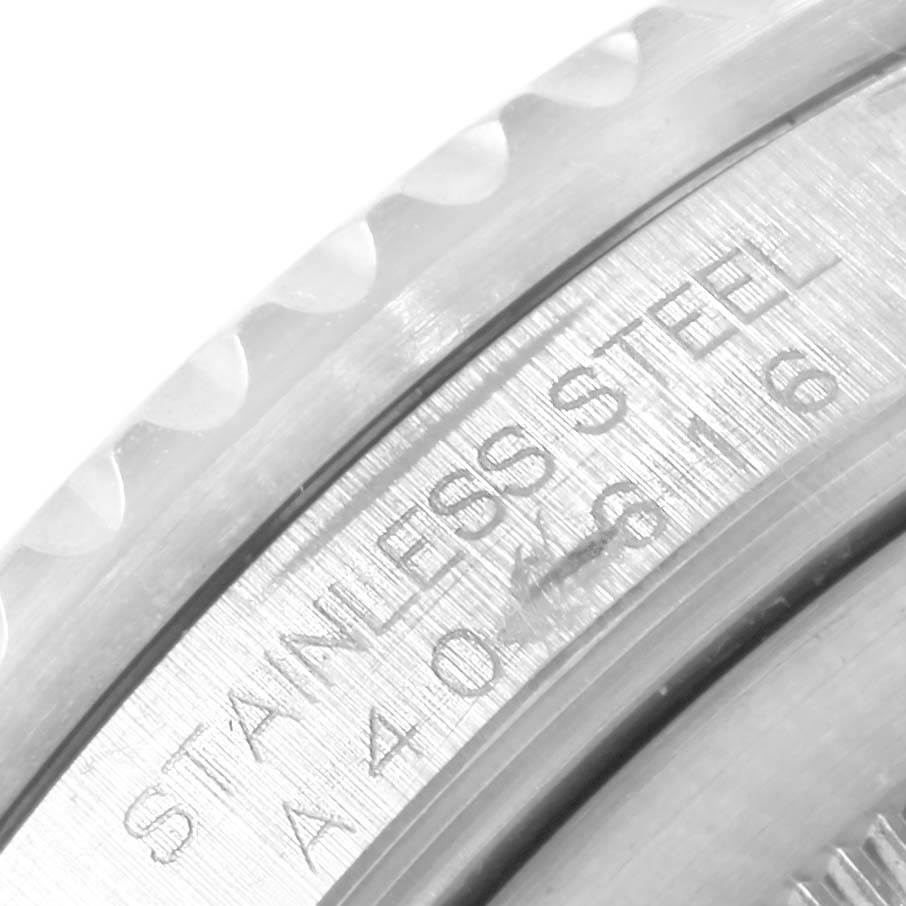 This close-up image shows the engraved "STAINLESS STEEL" marking on the case of a Rolex GMT-Master 16700 Men's Stainless Steel Black Dial 16700 Men's Stainless Steel Black Dial watch.
