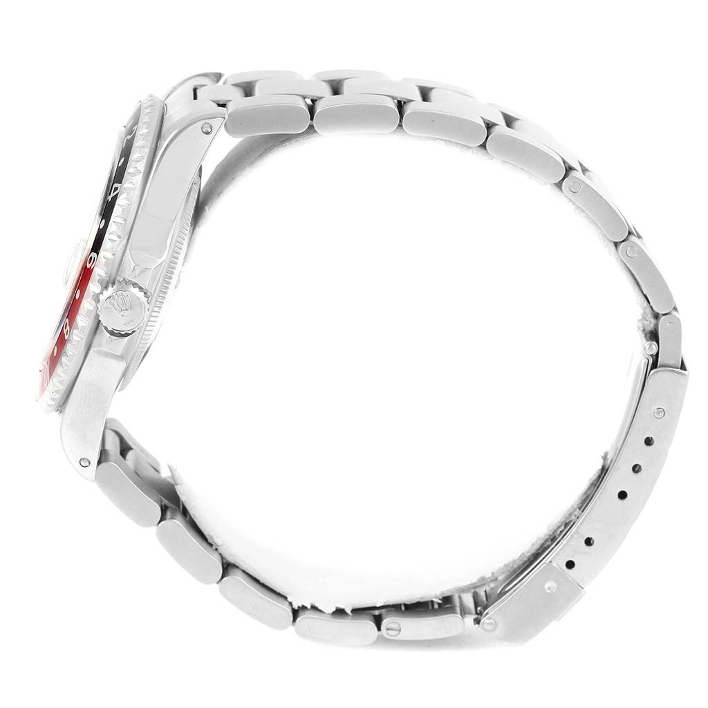 The image shows a side view of the Rolex GMT-Master 16700 Men's Stainless Steel Black Dial 16700 Men's Stainless Steel Black Dial watch, emphasizing the crown, bezel, and stainless steel bracelet.