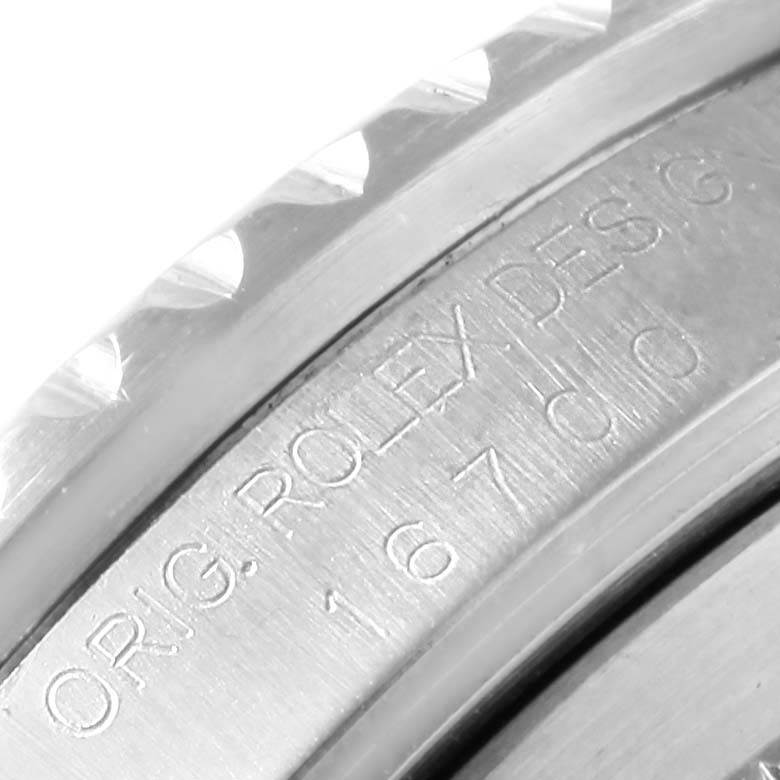 The image shows a close-up of the case side engraving on a Rolex GMT-Master 16700 Men's Stainless Steel Black Dial 16700 Men's Stainless Steel Black Dial watch.