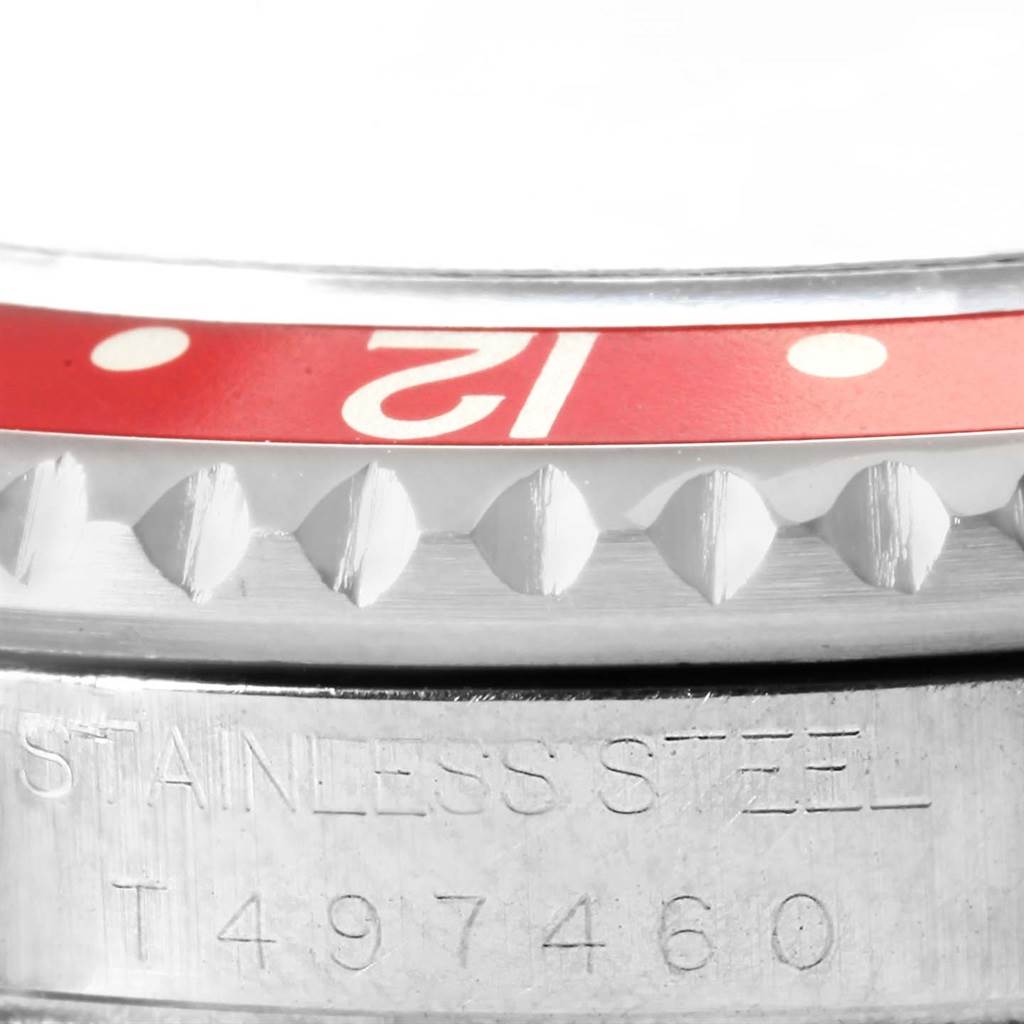 This image shows a close-up of the bezel and serial number inscription on a Rolex GMT-Master 16700 Men's Stainless Steel Black Dial 16700 Men's Stainless Steel Black Dial.