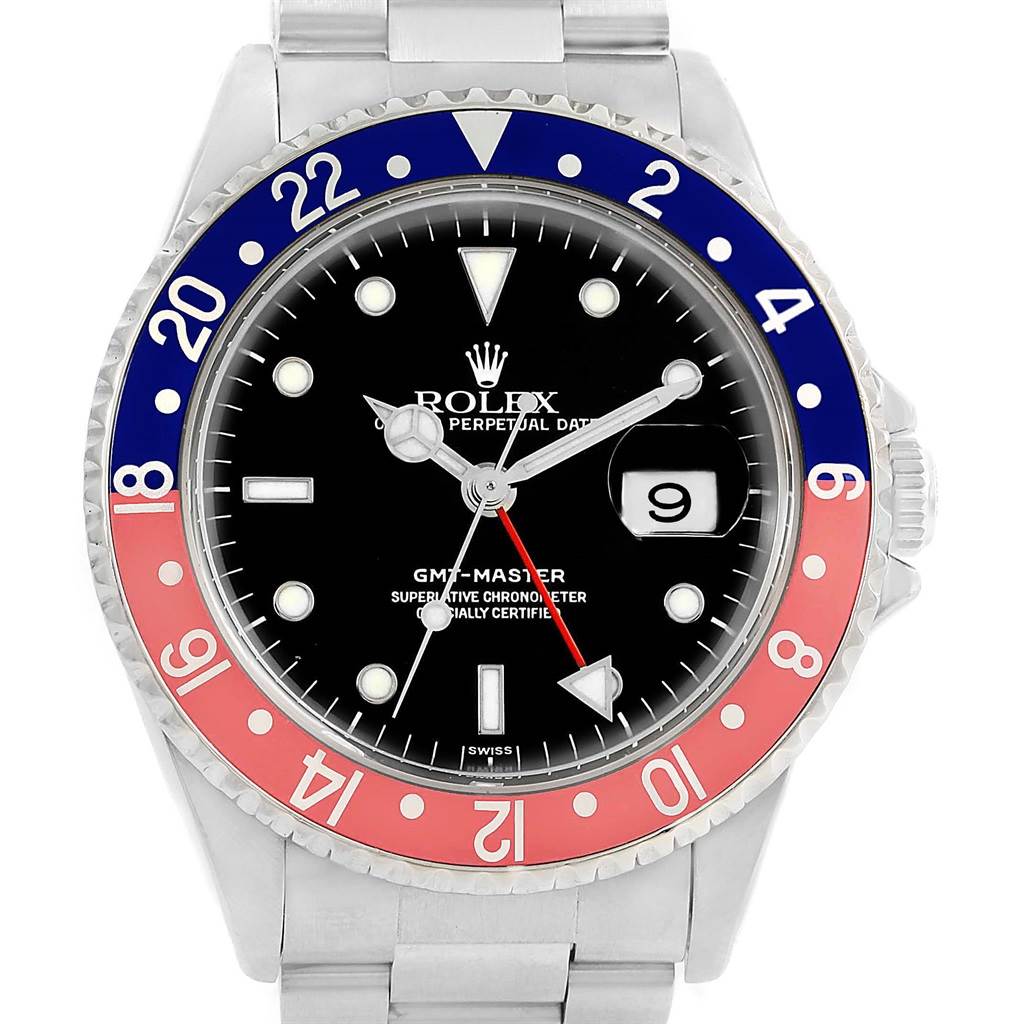 The image shows the face of the Rolex GMT-Master 16700 Men's Stainless Steel Black Dial 16700 Men's Stainless Steel Black Dial watch from a front angle, displaying the dial, hands, bezel, and part of the bracelet.