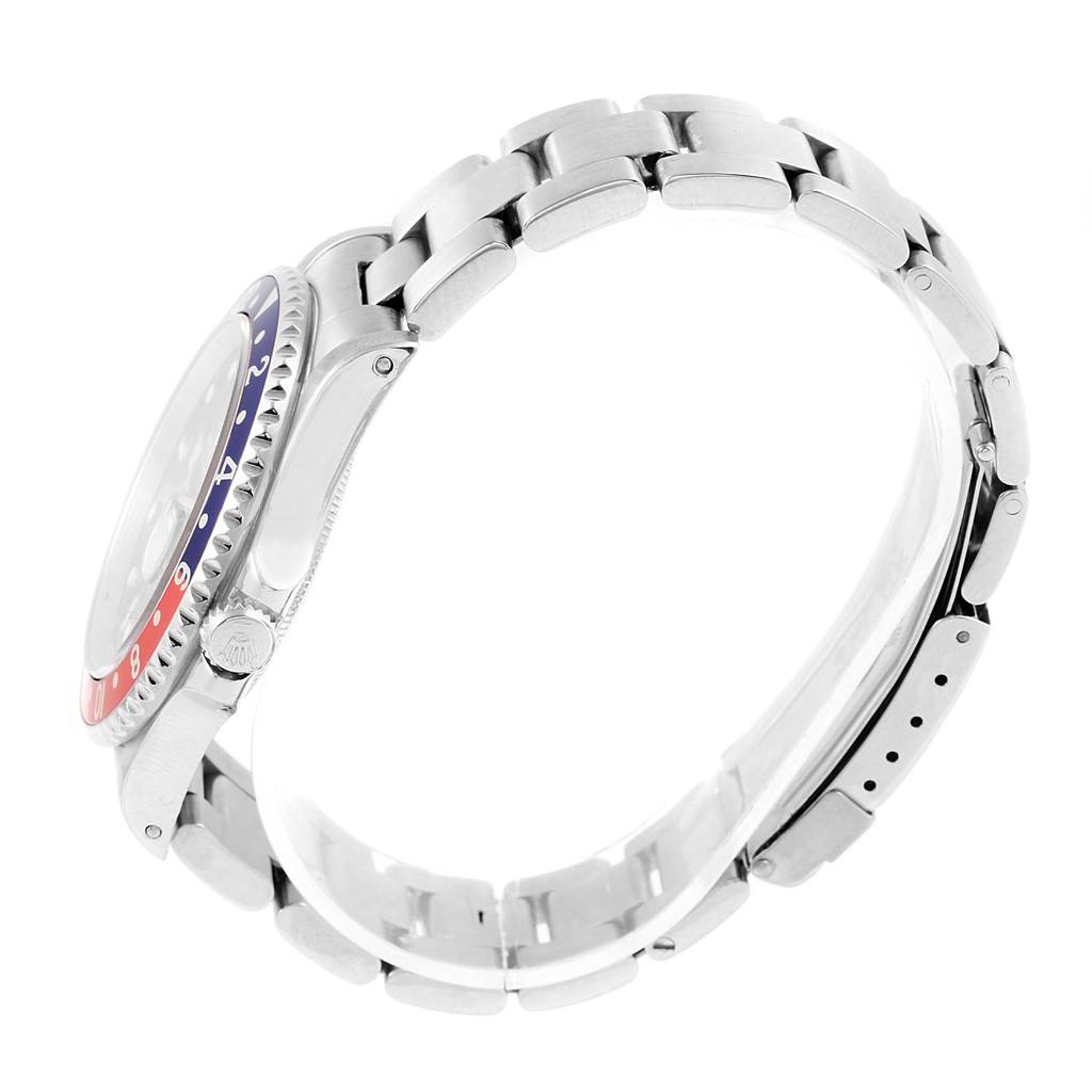 The image shows a side view of the Rolex GMT-Master 16700 Men's Stainless Steel Black Dial 16700 Men's Stainless Steel Black Dial watch, highlighting the bezel, crown, and bracelet.