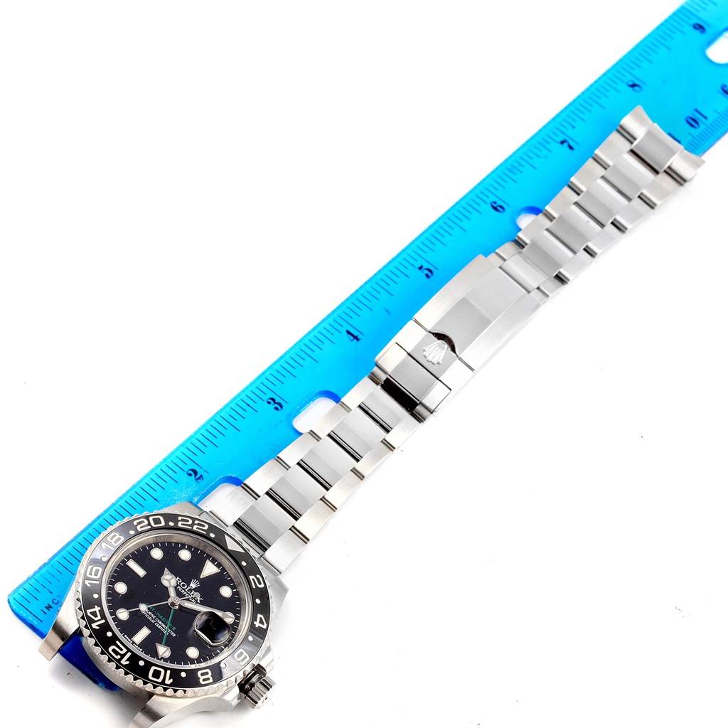 The Rolex GMT-Master 116710 Men's Stainless Steel Black Dial 116710 Men's Stainless Steel Black Dial watch is shown from a top-down angle, including the face, bezel, and full bracelet with clasp.