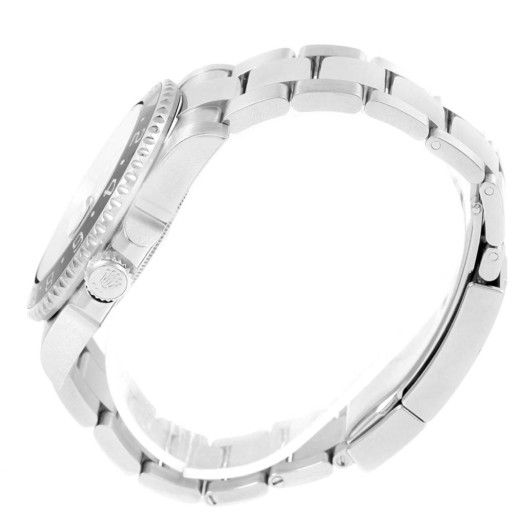 This side-angle image of a Rolex GMT-Master 116710 Men's Stainless Steel Black Dial 116710 Men's Stainless Steel Black Dial watch shows the case, bezel, crown, and part of the bracelet.