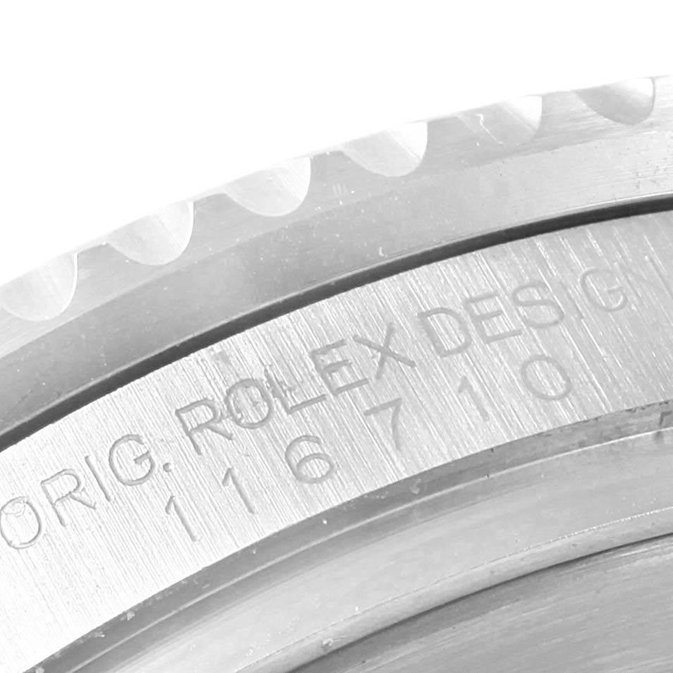 The image shows a close-up of the side of the bezel and the engraved case between the lugs of the Rolex GMT-Master 116710 Men's Stainless Steel Black Dial 116710 Men's Stainless Steel Black Dial watch.