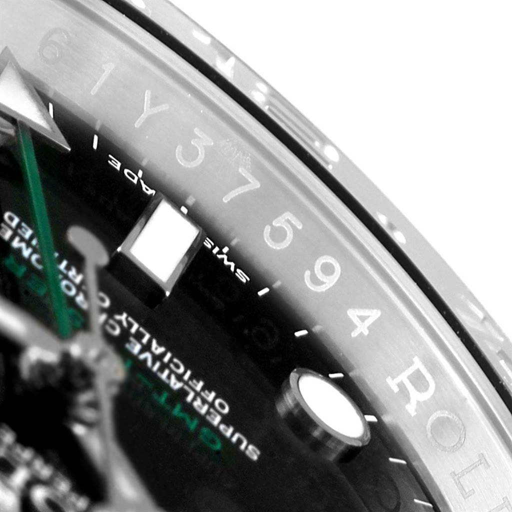The image shows a close-up angle of the dial and bezel, showcasing the details and text on the Rolex GMT-Master 116710 Men's Stainless Steel Black Dial 116710 Men's Stainless Steel Black Dial watch.