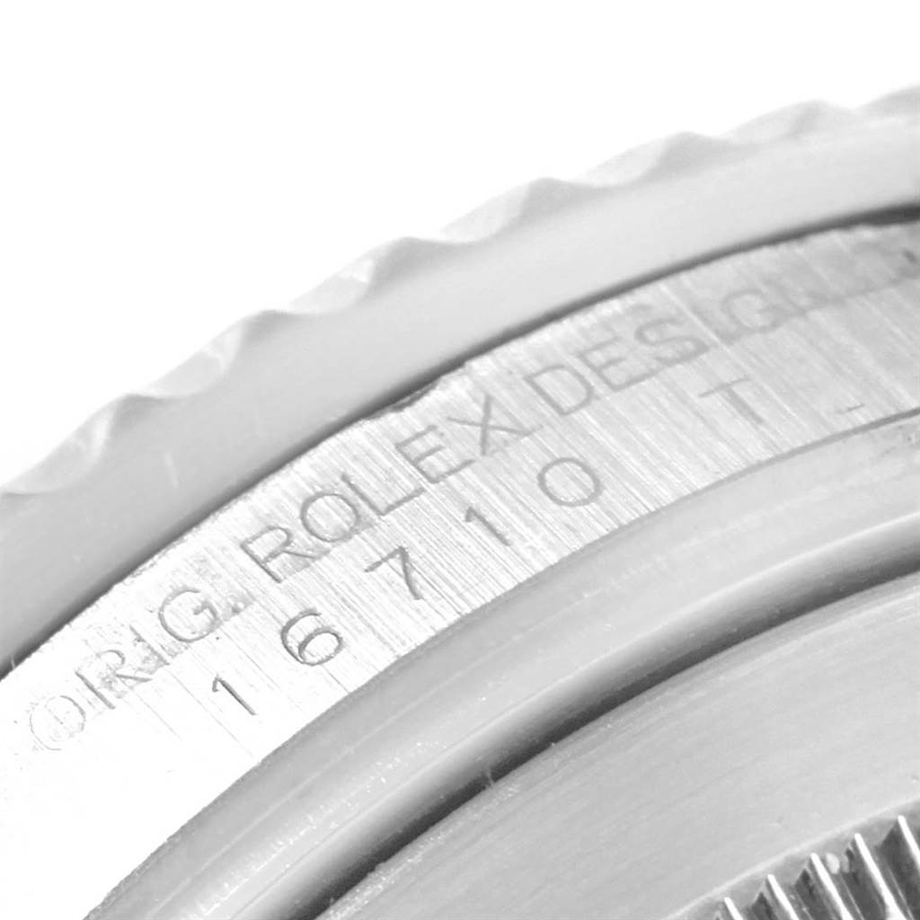 The image shows a close-up of the model number engraving on the case side of a Rolex GMT-Master 16710 Men
s Stainless Steel Black Dial 16710 Men
s Stainless Steel Black Dial watch.
