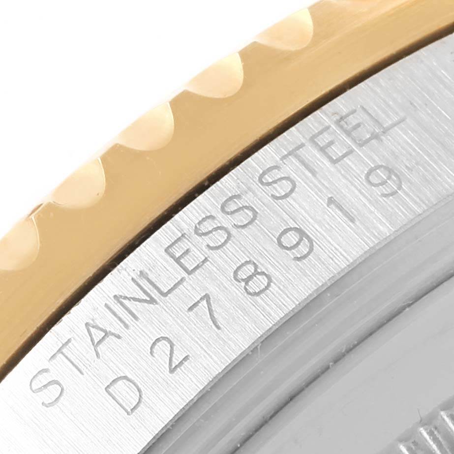 The image shows a close-up of the serial number engraving and partial bezel of the Rolex GMT-Master 16713 Men's Stainless Steel Brown Dial 16713 Men's Stainless Steel Brown Dial watch.
