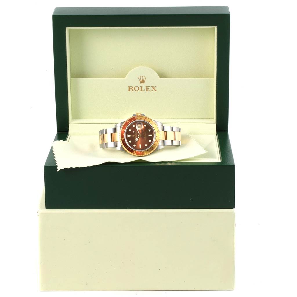 This Rolex GMT-Master 16713 Men's Stainless Steel Brown Dial 16713 Men's Stainless Steel Brown Dial watch is shown front-on, placed inside its green branded box.
