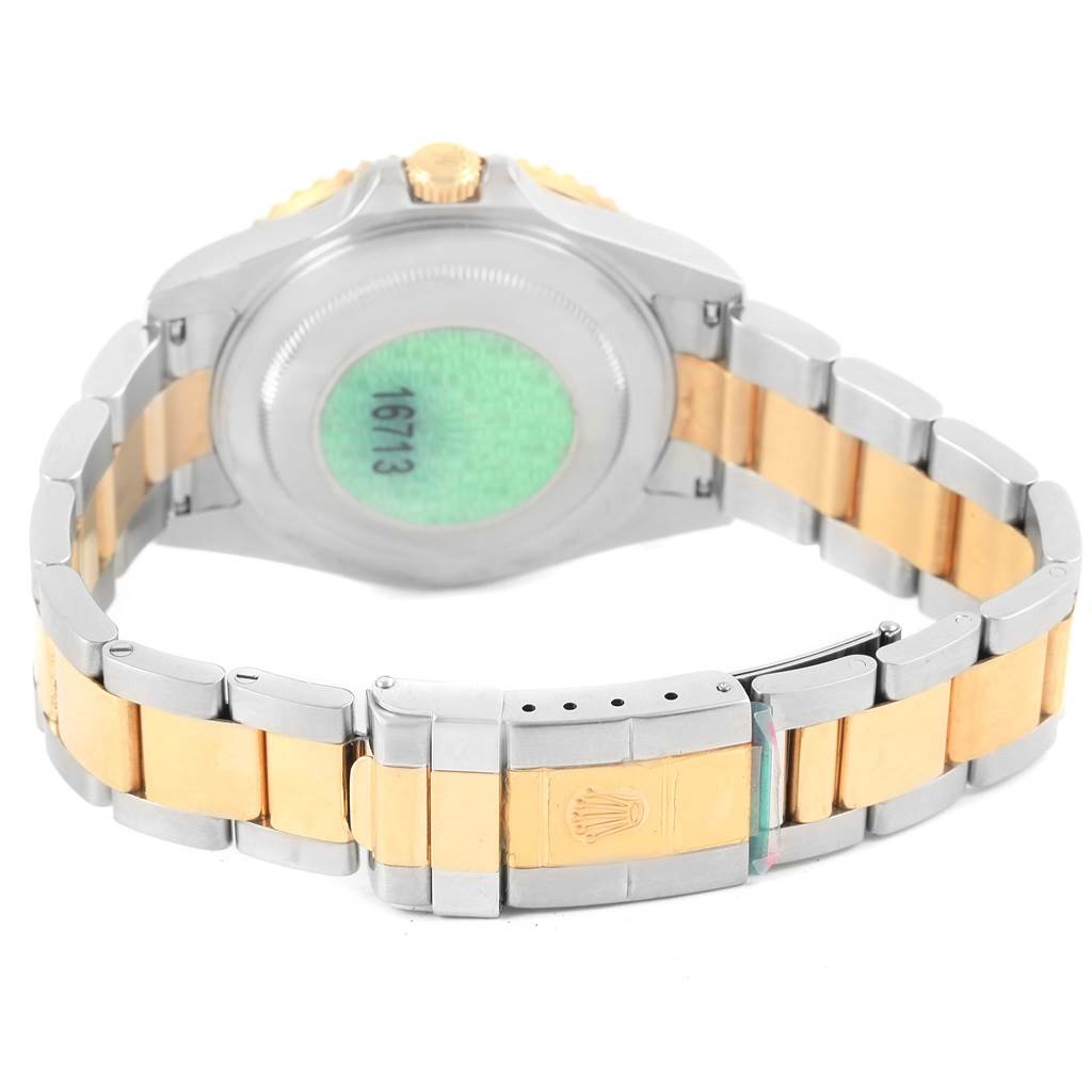 The image shows the backside and bracelet of a Rolex GMT-Master 16713 Men's Stainless Steel Brown Dial 16713 Men's Stainless Steel Brown Dial watch, highlighting its two-tone metal design and clasp.