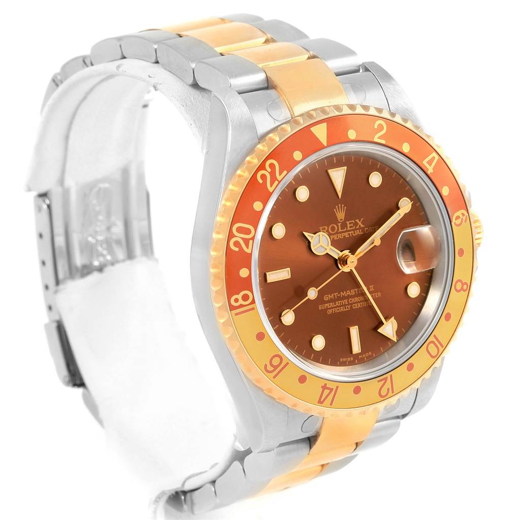 The image shows a Rolex GMT-Master 16713 Men's Stainless Steel Brown Dial 16713 Men's Stainless Steel Brown Dial watch at a slight angle, highlighting its bezel, dial, and two-tone bracelet.