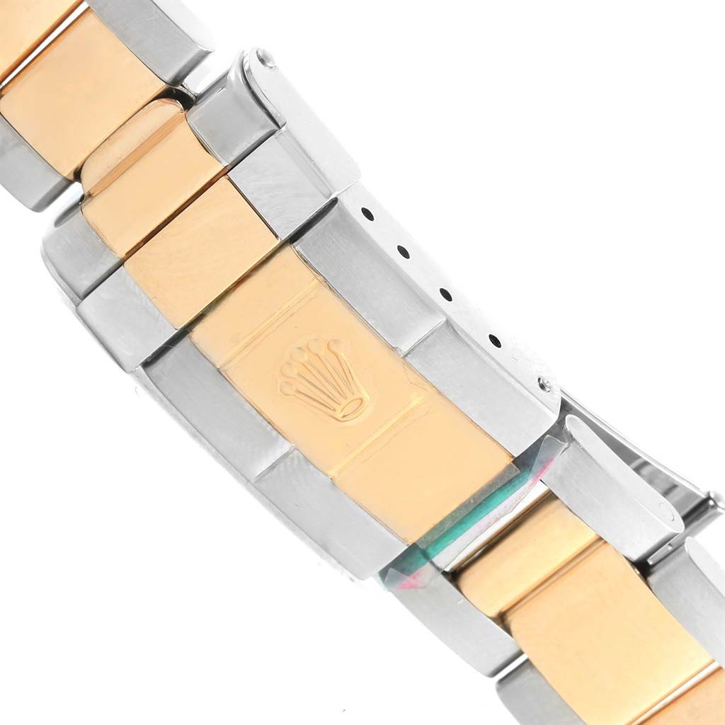 This image shows a close-up of the metal bracelet clasp of a Rolex GMT-Master 16713 Men's Stainless Steel Brown Dial 16713 Men's Stainless Steel Brown Dial, featuring the Rolex logo.