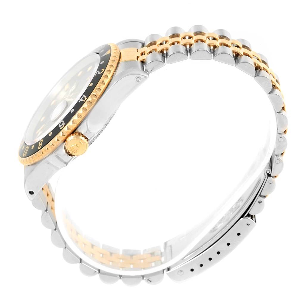 The image shows a side view of the Rolex GMT-Master 16713 Men's Stainless Steel Silver Dial 16713 Men's Stainless Steel Silver Dial watch, highlighting its crown, bezel, and two-tone bracelet.