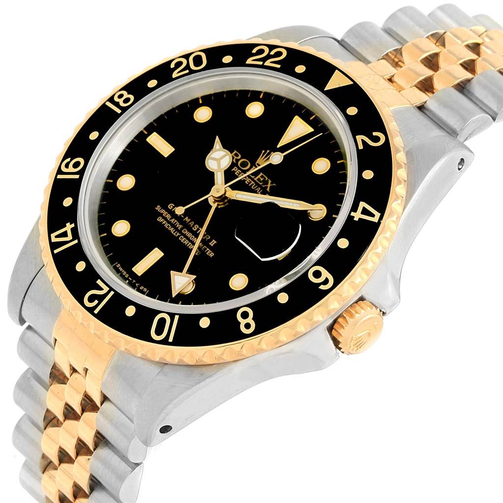 This image shows a close-up of the Rolex GMT-Master 16713 Men's Stainless Steel Silver Dial 16713 Men's Stainless Steel Silver Dial II watch featuring a black dial, two-tone bezel, and jubilee bracelet at an angle.